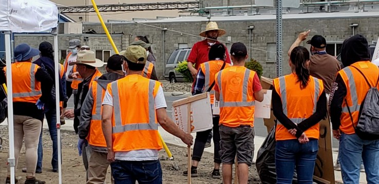 Workers listening to speaker during Allan Bros. strike