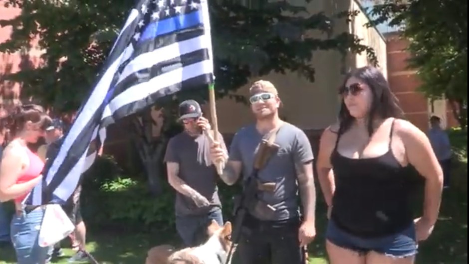 Male with gun and Thin Blue Line Flag Lynden 070520